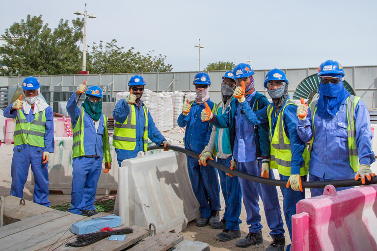 Workers at a FIFA World Cup Qatar 2022™ construction site